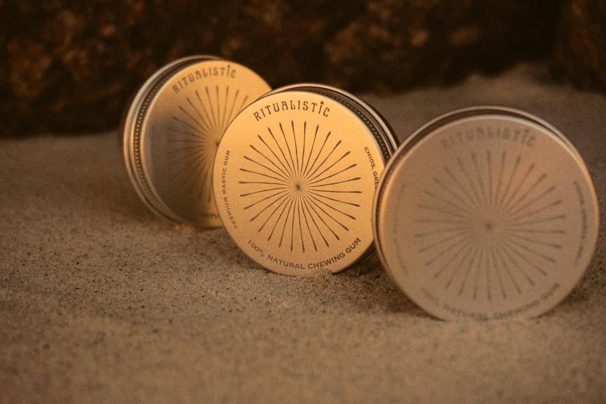 Ritualistic tins in golden sand.
