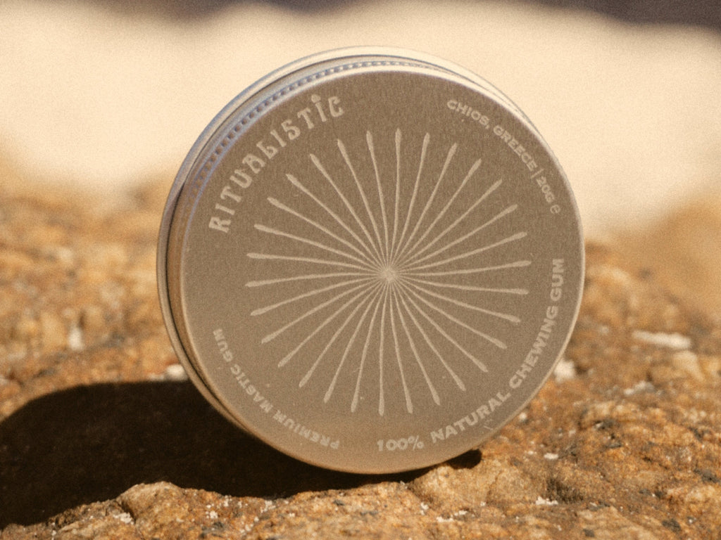Ritualistic tin resting on sunlit rock.